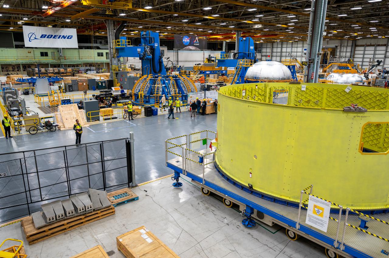 Crews at NASA’s Michoud Assembly Facility in New Orleans move the forward skirt of NASA’s Space Launch System (SLS) rocket to another part of the facility Dec. 15. Teams are preparing to apply the thermal protection system to the flight hardware, which will protect it from the extreme temperatures during launch and flight. The forward skirt is part of the core stage that will power the SLS rocket for the Artemis III mission. The forward skirt houses flight computers, cameras, and avionics.. The SLS core stage is made up of five unique elements: the forward skirt, liquid oxygen tank, intertank, liquid hydrogen tank, and the engine section. When fully stacked, the forward skirt is located at the top of the core stage and connects the stage to the upper part of the rocket. Together with its four RS-25 engines, the rocket’s massive 212-foot-tall core stage — the largest stage NASA has ever built — and its twin solid rocket boosters produce 8.8 million pounds of thrust to send NASA’s Orion spacecraft, astronauts and supplies beyond Earth’s orbit to the Moon and, ultimately, Mars. Offering more payload mass, volume capability and energy to speed missions through space, the SLS rocket, along with NASA’s Gateway in lunar orbit, the Human Landing System, and Orion spacecraft, is part of NASA’s backbone for deep space exploration and the Artemis lunar program. No other rocket is capable of carrying astronauts in Orion around the Moon in a single mission.